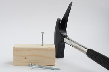 Hammer and screw, isolated on white background