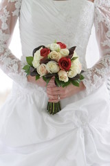 white dress flower bouquet in hands
