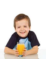 Little boy with a glass of fruit juice