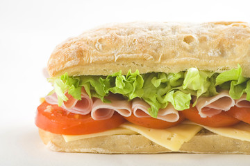 delicious sandwich of ham cheese lettuce tomato