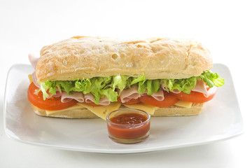delicious sandwich of ham cheese lettuce tomato
