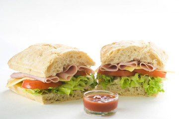 delicious sandwich of ham cheese lettuce tomato