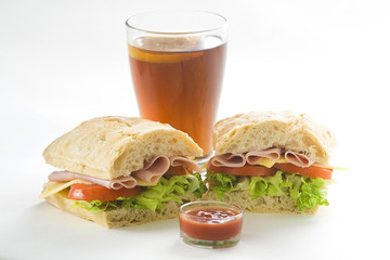 delicious sandwich of ham cheese lettuce tomato