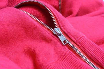 Detail of open pink jacket zipper