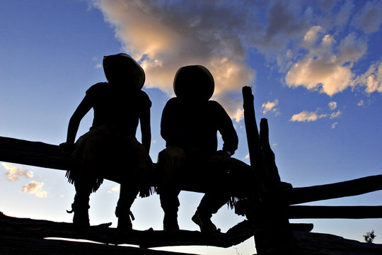 Silhouetted Cowboys