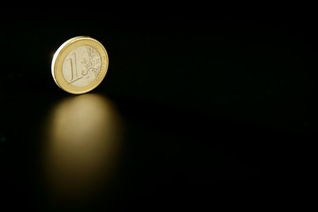 Euro currency coin macro with reflection