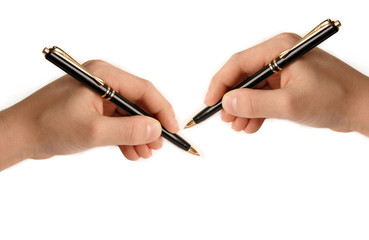Two hands writing on white paper
