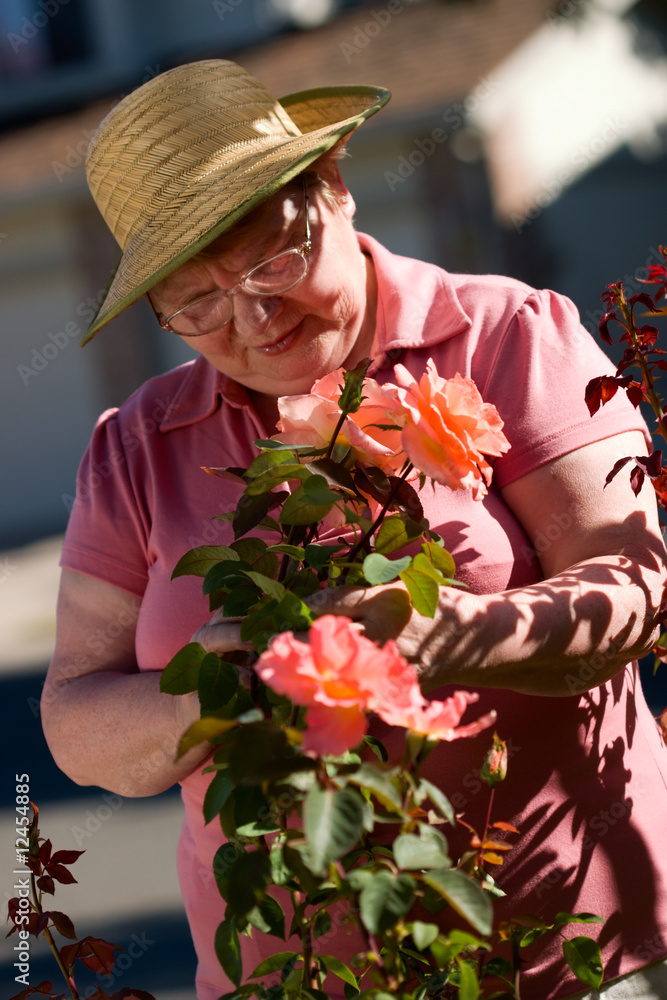 Wall mural Senior lady in garden