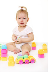 Baby playing with colored blocks