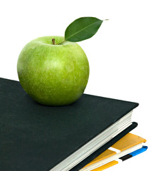 Apple on top of books