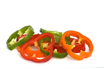 Longitudinal sections of green, yellow and red sweet peppers iso