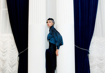 girl between two columns