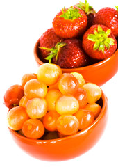 cherry and strawberry on red plates