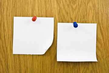 Reminders notes with pins on wooden background