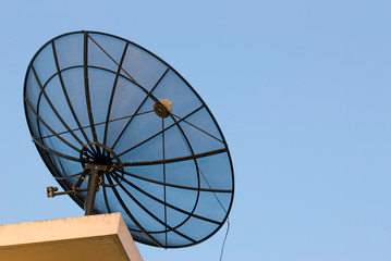 A parabolic antenna on a roof