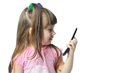 Obraz premium little girl with a mobile phone