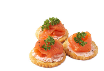 Smoked salmon and cream cheese on crackers
