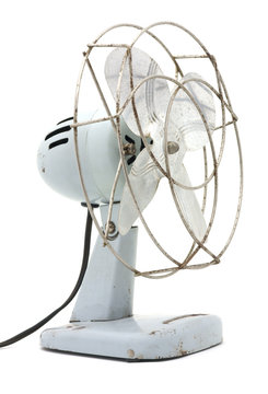 Side view of an antique electric fan.