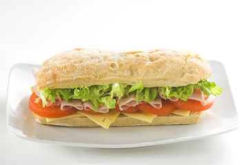 delicious sandwich of ham cheese lettuce tomato