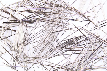 A stack of pins on white background