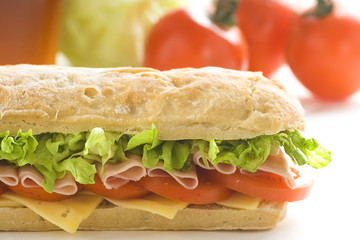 delicious sandwich of ham cheese lettuce tomato