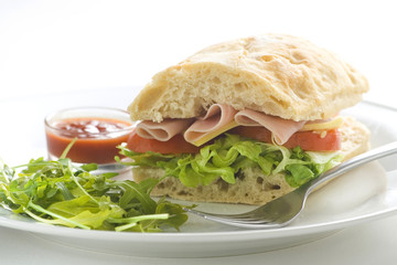 delicious sandwich of ham cheese lettuce tomato