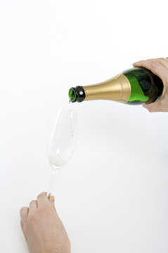 filling a glass with champagne