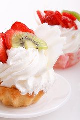 Closeup of cream and strawberries topping