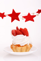 Closeup of cream and strawberries topping