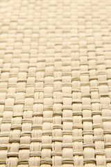 Abstract yellow woven thatch textured background with shallow de
