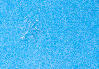 Fototapeta na wymiar snowflake on blue
