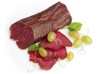 Jerked beef meat decorated with green grape