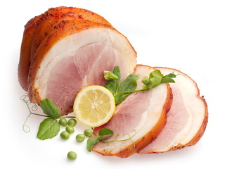 Cold boiled pork decorated with lemon and green pea
