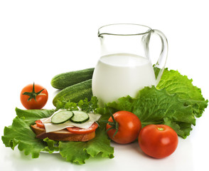 Jug of milk and fresh vegetables