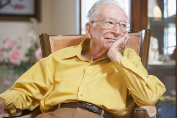 Senior man relaxing in armchair