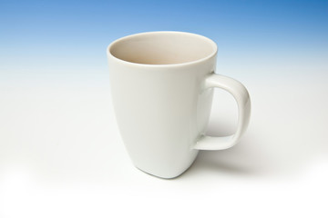A white china mug of tea.