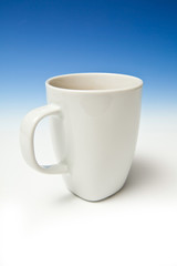 A white china mug of tea.