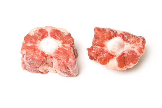 Ox tail pieces isolated on a white studio background.