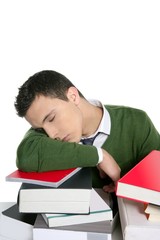boy student sleeping over stack books over desk