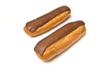 Cream eclairs isolated on a white studio background