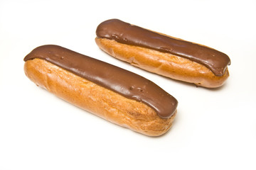Cream eclairs isolated on a white studio background
