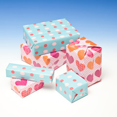 Presents or gift's on a graduated blue studio background.