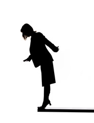 Silhouette of a woman on the edge