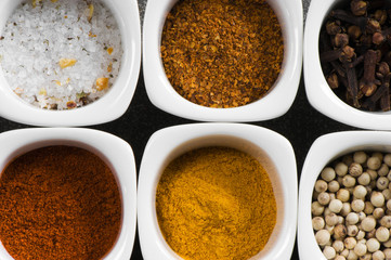 view over several pots with ground spices