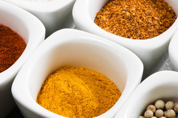 view over several pots with ground spices