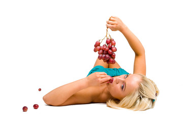 blonde girl in blue with grapes