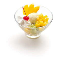 Ice-cream balls decorated with cherry, orange and kiwi