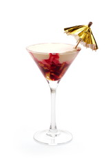 Ice-cream cocktail with cherry jam decorated with umbrella
