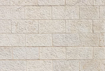 Fotobehang Vertical wall built of Jerusalem stone blocks © slavapolo