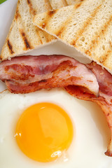 Breakfast - toasts, eggs, bacon